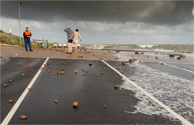 Debris litters the car park as more storm clouds gather